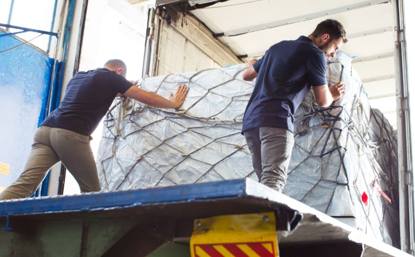 Air Freight 2 men loading cargo