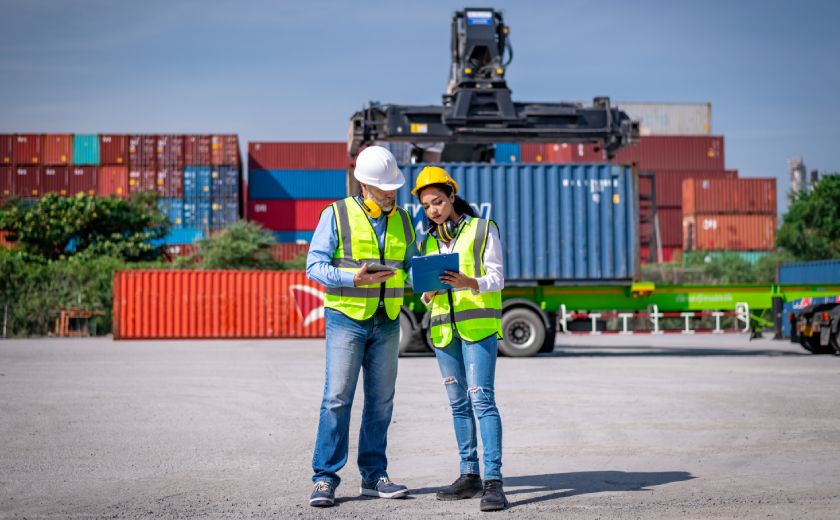 Land Freight Man and Woman Checking the List