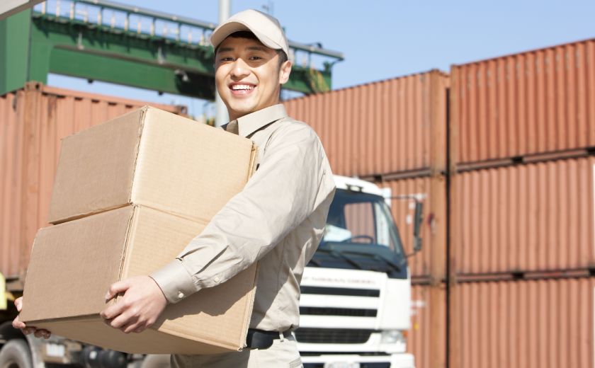 Relocation Service Man Carrying a Package